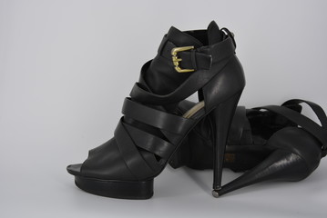 Sexy glamorous black women's sandals from genuine cowhide matte leather on high heels. Fashion...