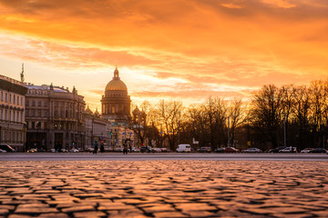 Sunset on the Palace Square in St. Petersburg, a golden sunset overlooking St. Isaac's Cathedral