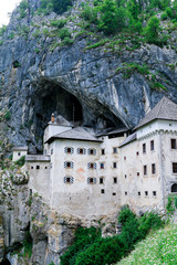 Predjama Castle, a medieval castle, built in the mouth of a cave on a cliff face near Postojna in Slovenia