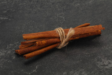 Aroma cinnamon sticks over dark