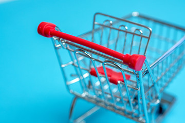 buying via online shop is easy as pie, small miniature shopping cart from above
