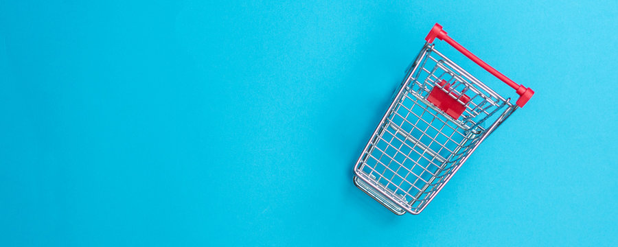 buying via online shop is easy as pie, small miniature shopping cart from above
