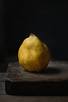 Close up of quince on wooden board
