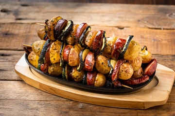 Potato skewers with sausage and zucchini