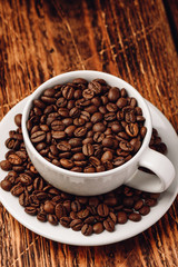 Cup full of roasted coffee beans