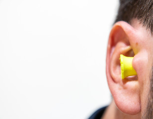 Noise reduction ear plug close up in ear