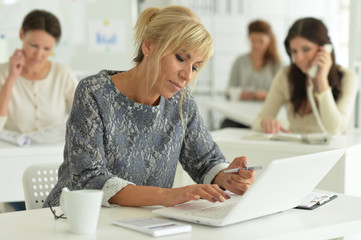 Portrait of women working together in office