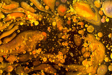 Obraz na płótnie Canvas Yellow liquid bubbles abstract background. Macro photography
