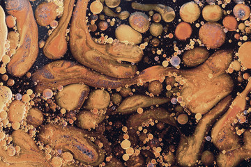 Yellow liquid bubbles abstract background. Macro photography