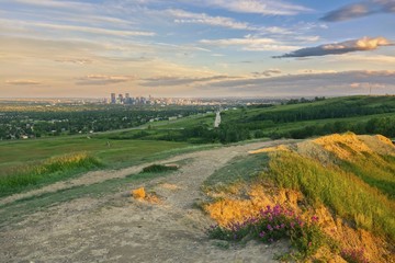 Calgary City Center Panorama from Nose Hill Urban park, Hazy Sunset Skyline