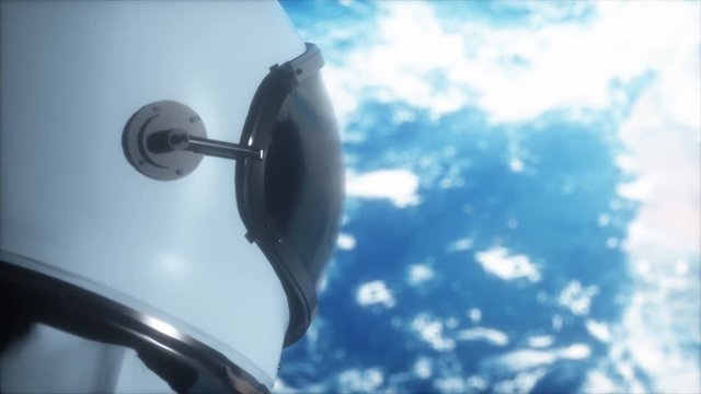 A lone astronaut looks at the planet earth in orbit in outer space, the planet earth reflects in a spacesuit helmet. Cinematic 4k footage for scientific programs on space, planet earth and others