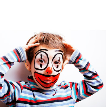 little cute boy with facepaint like clown, pantomimic expressions close up