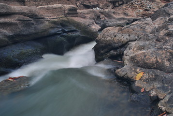 water flow in the river with brown river edges
