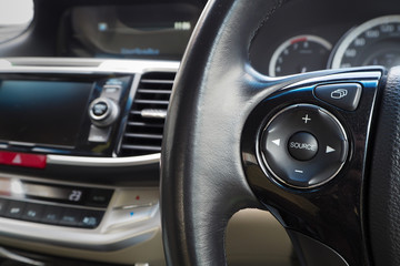 Obraz premium source button on steering wheel.