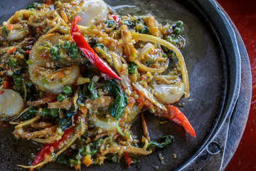 Spicy Seafood  stir fried (Pad Cha) on hot pan in restaurant, Thai Signature Food