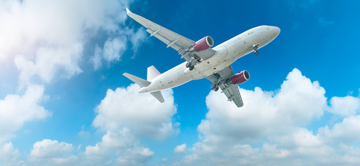 Commercial airplane flying in the blue sky