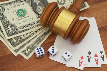 Gambling and law theme, playing cards, money, dices and judge gavel