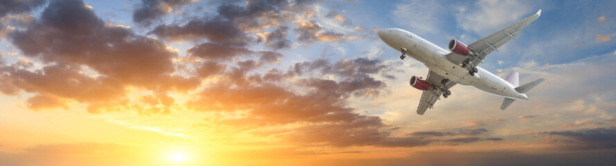 Airplane in the sky at sunrise