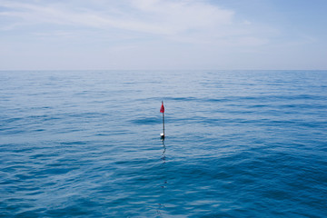 Bouy in the blue ocean