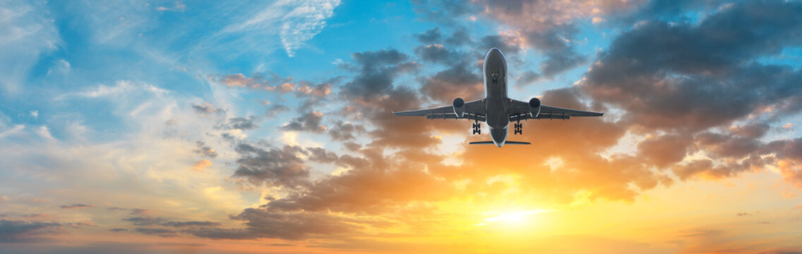 Airplane in the sky at sunrise