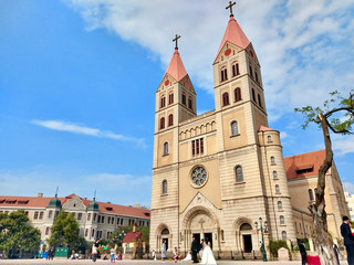 Qingdao Christian Church surround the German building style that is the tourist landmark at Qingdao, China - obrazy, fototapety, plakaty