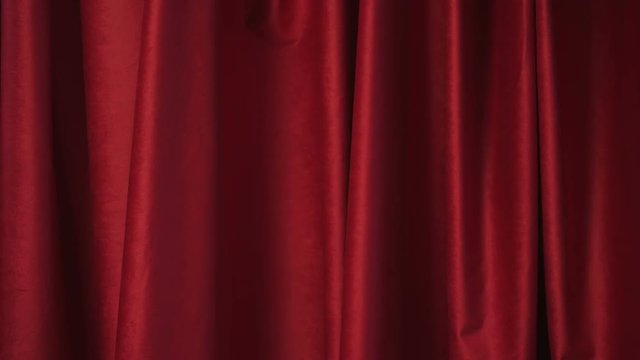 The red curtain moves gently. He is blowing in the wind. A perfect background for different occasions.
