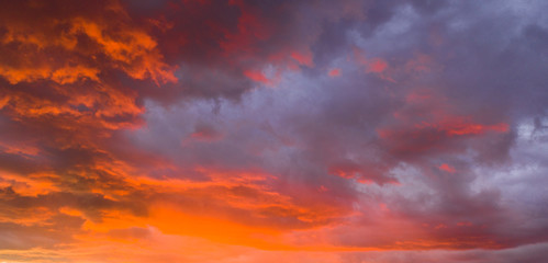 Fire Orange Sunset With Blue Cloud Background