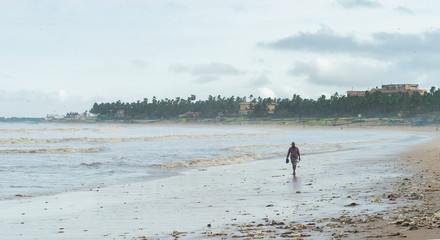 man walking on beach