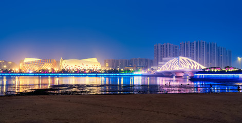 Fototapeta premium Nightscape Skyline of Urban Architecture along Qingdao Coastal Line..
