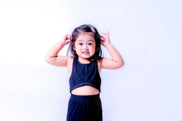 little girl in black dress. portrait of a little girl. happy little girl in studio, fashion kids portrait white bacground.