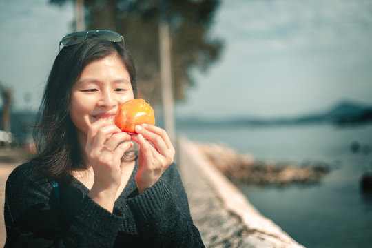 Woman Eating Traditional Chinese Sweet Sticky Rice Cake