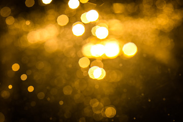 Obraz premium Abstract gold bokeh with black
