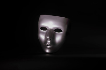matte metal mask on black background
