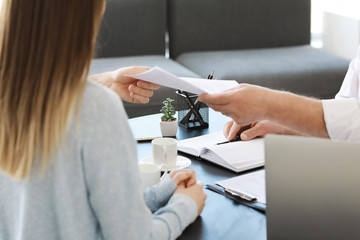 Couple meeting with notary public in office