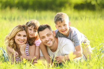 Happy family in park on summer day