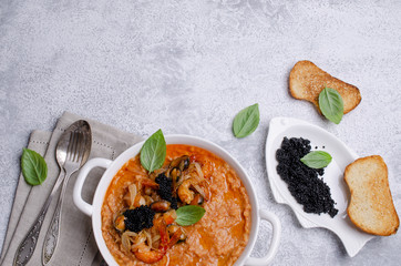 Red lentils with fried seafood