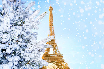 Eiffel Tower is the main attraction of Paris on the background of decorated Christmas trees in December. Travel Greeting Card.