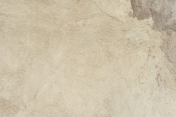Texture of a concrete wall with cracks and scratches which can be used as a background