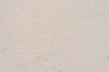 Texture of a concrete wall with cracks and scratches which can be used as a background
