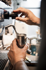 Fototapeta na wymiar barista pouring coffee