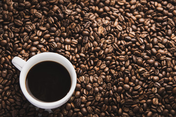 cup of coffee with beans background
