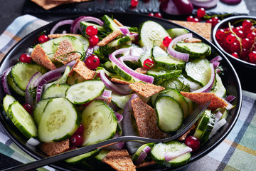 fresh summer salad of cucumber, red currant
