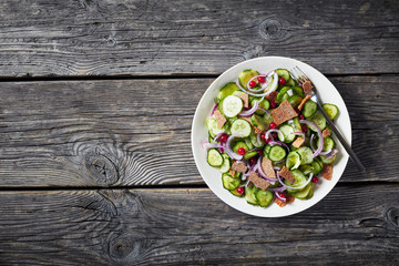 summer cucumber salad in a white bowl