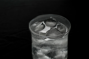 Ice water in low key light photography or dark food photography