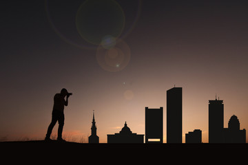 Traveler facing the skyline of the city of Boston in the United States