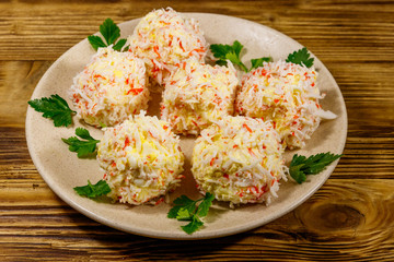 Appetizer of crab-cheese balls on wooden table