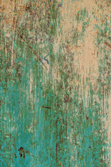 old faded wooden planks and metal patch for them. Metal patch on the wooden door. Green peeling wooden background