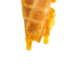 bottom of an ice cream cone with drips on white