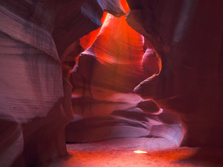 the sun shines on the floor of upper antelope canyon, az