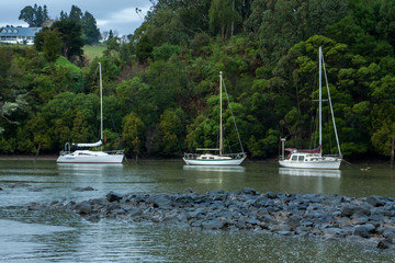 Fototapeta na wymiar three yachts moored in the bend of the river